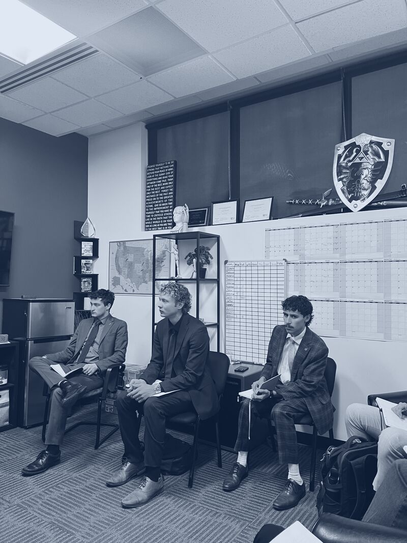 Icarus Acquisitions team members taking notes during a training meeting