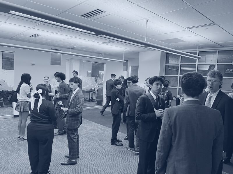 Icarus Acquisitions team members networking and talking strategy in the office